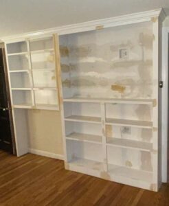 Custom built-in shelving preparation and wall repair before painting in Massachusetts