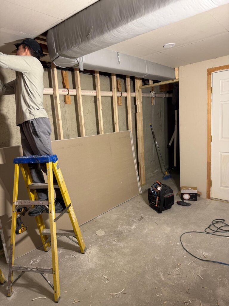 Precision drywall installation for a basement remodeling project.