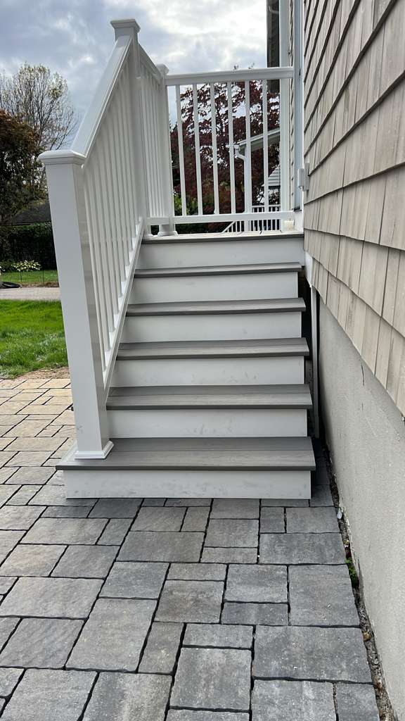 Finished exterior stairs with composite treads and white risers