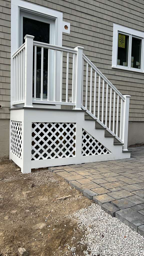 Finished exterior stairs and landing with lattice skirting